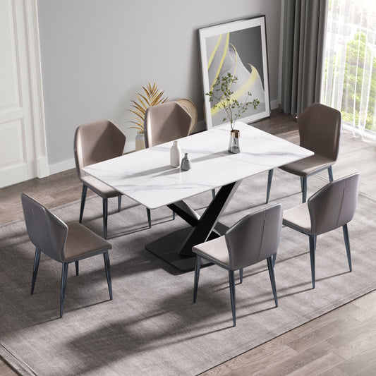 Modern white marble dining table with sleek black pedestal base and six upholstered chairs