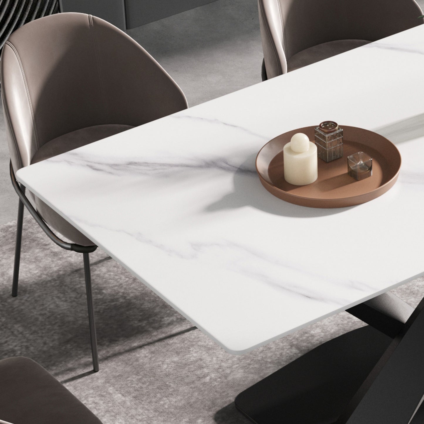 Modern white marble dining table with sleek metal legs and taupe upholstered chairs