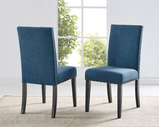 Blue upholstered dining chairs with nailhead trim and dark wood legs