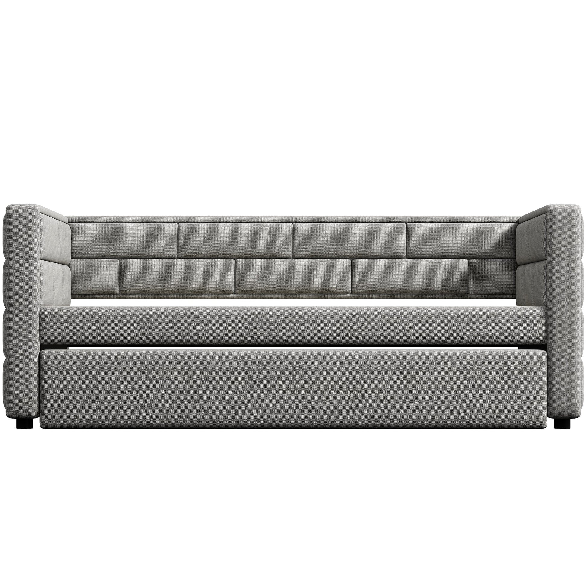 Gray upholstered sofa with tufted backrest and low profile