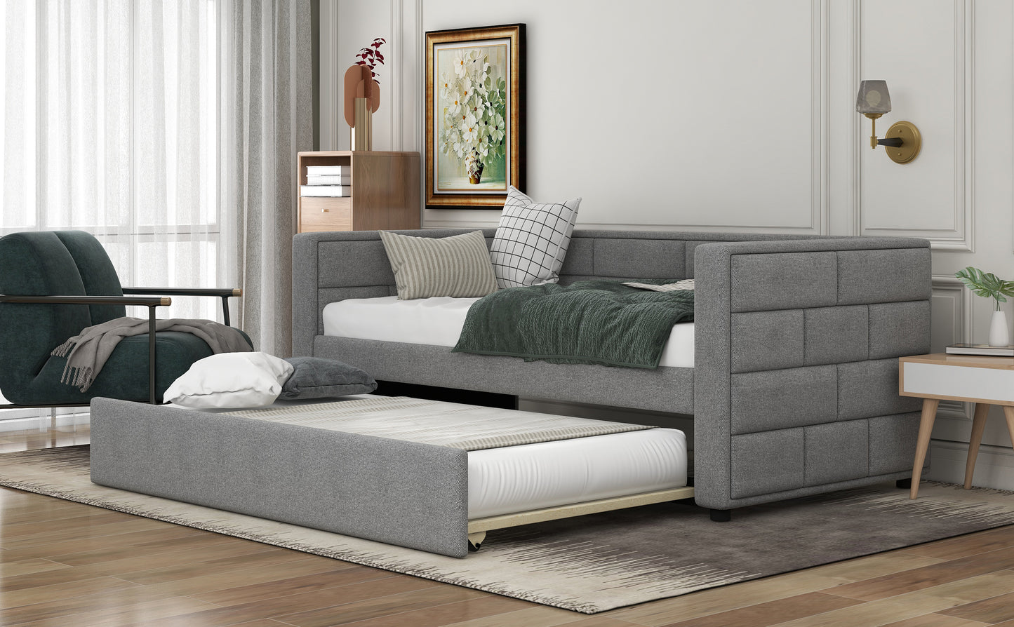 Gray upholstered daybed with a trundle perfect for guest rooms and small spaces