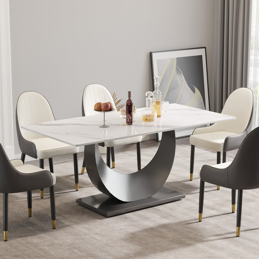 White marble dining table with modern curved metal base and upholstered chairs