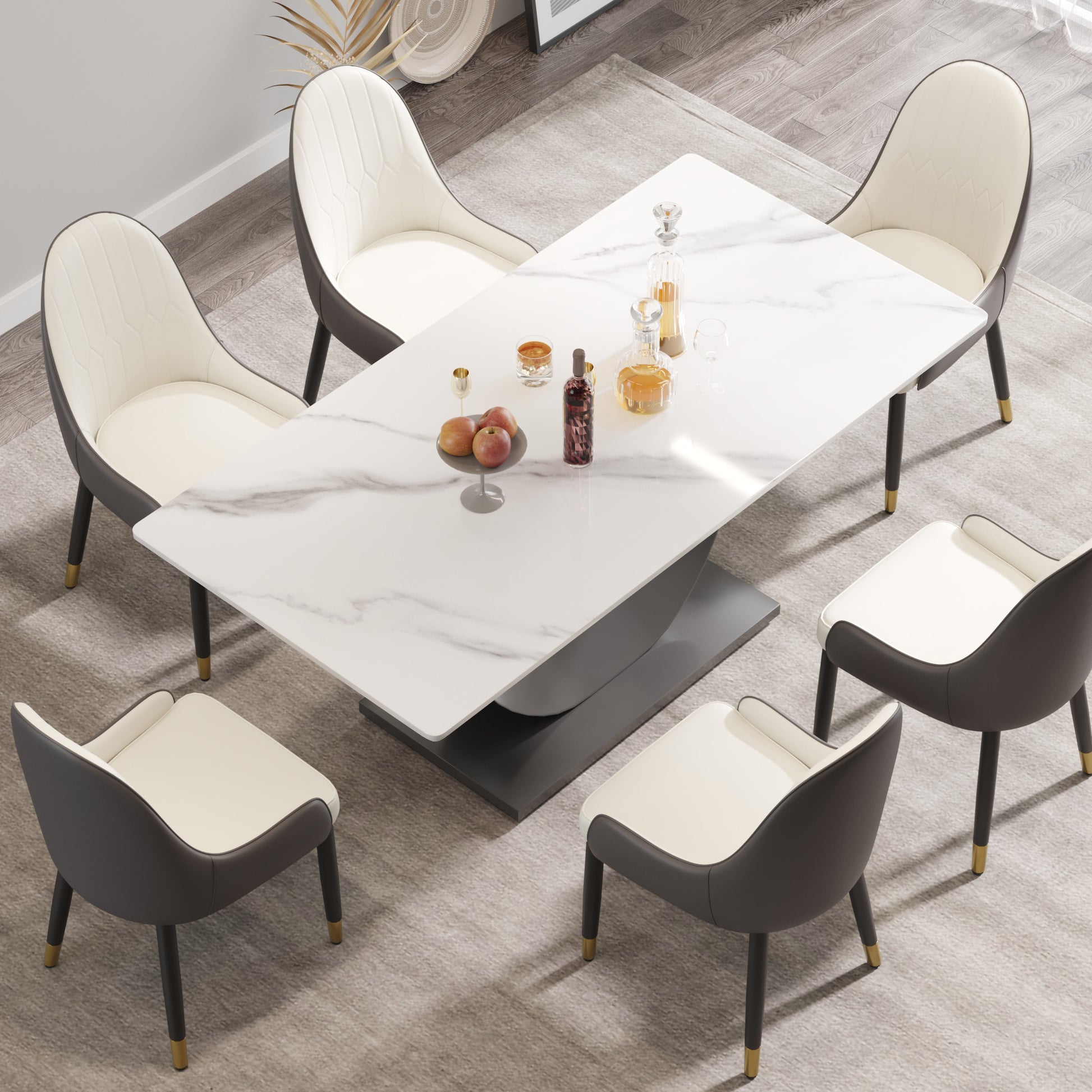 Modern marble dining table with white and grey upholstered chairs