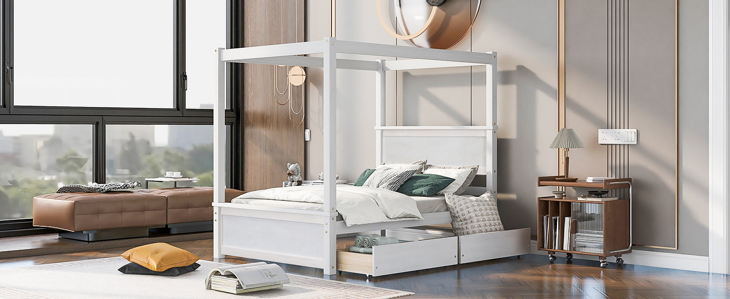 White wooden canopy bed with storage drawers and upholstered pillows