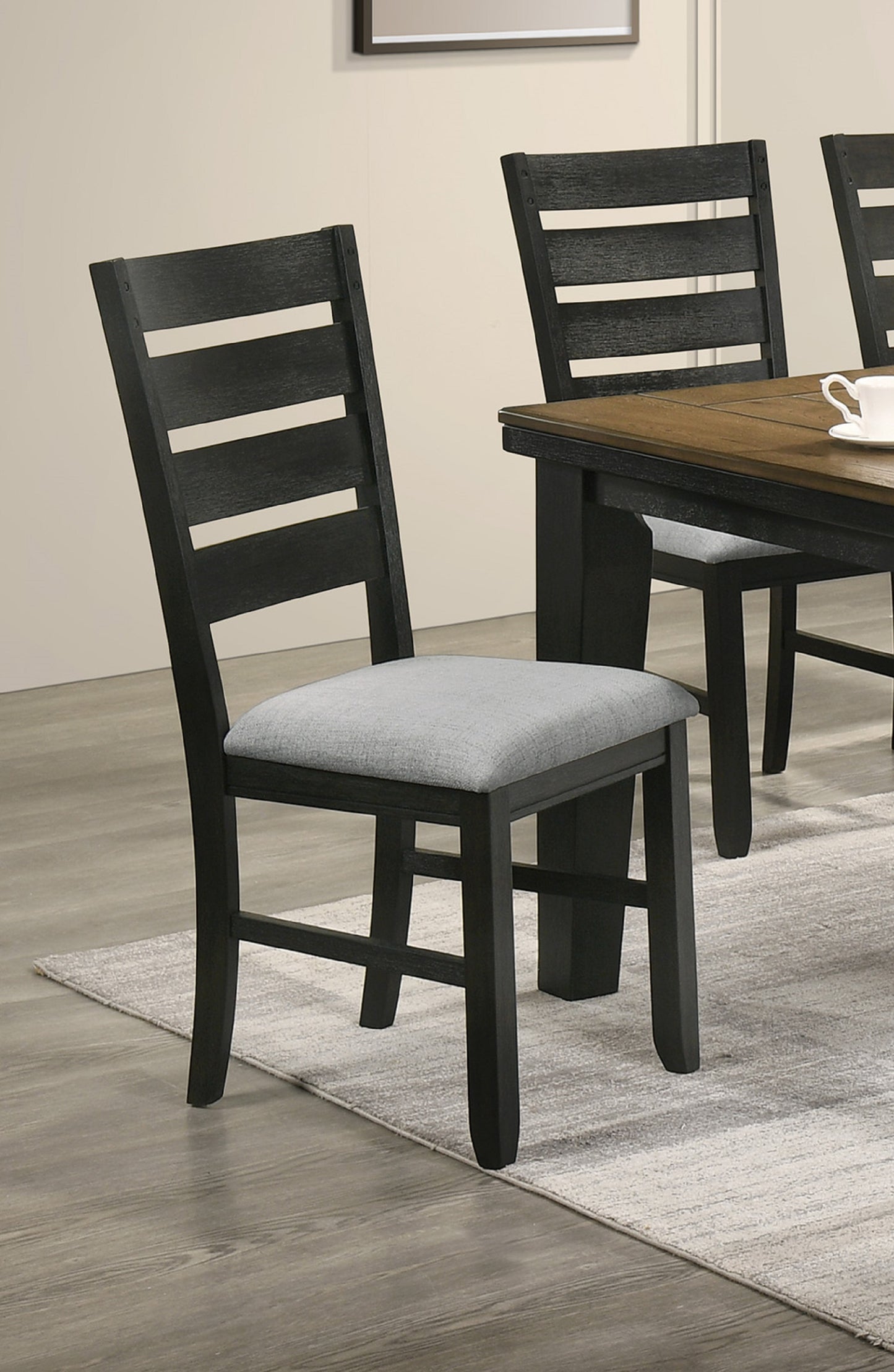 Black ladder back dining chair with grey fabric seat