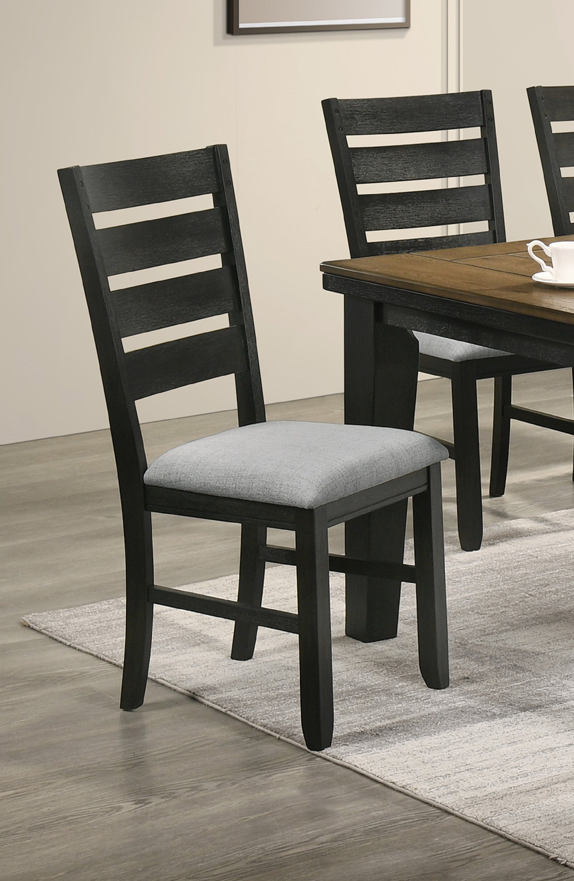 Black ladder back dining chair with grey fabric seat