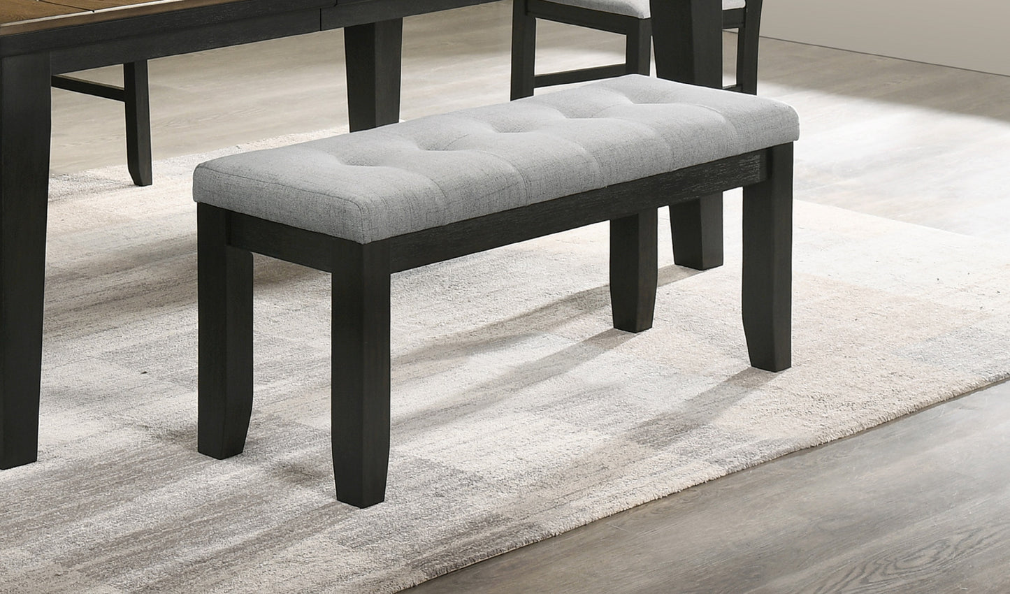 Tufted grey fabric dining bench with dark wood legs