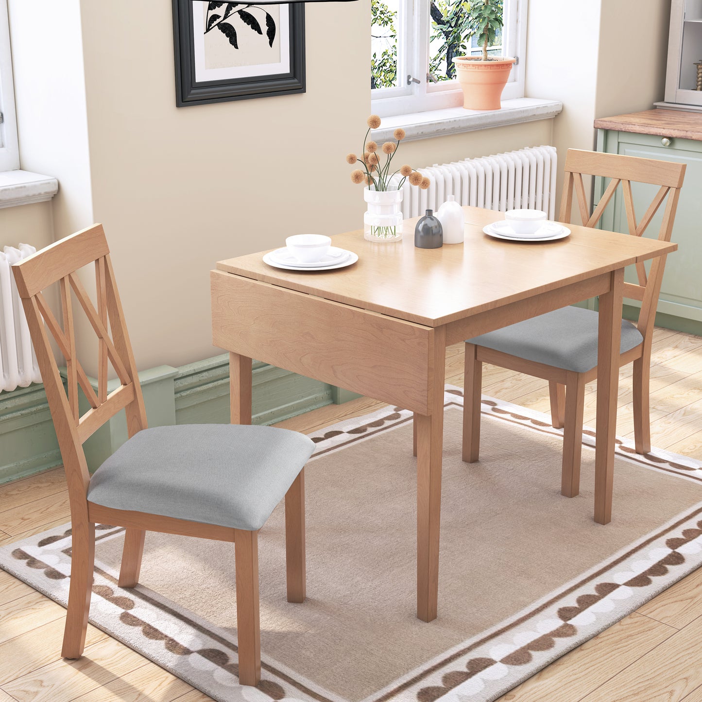 Light oak drop leaf dining table with grey upholstered chairs