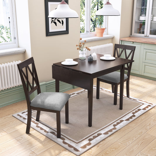 Dark wood dining table with drop leaf extension and two upholstered chairs