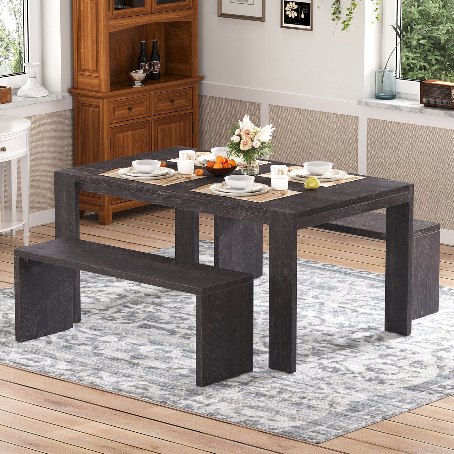 Dark wood dining table and benches set for four