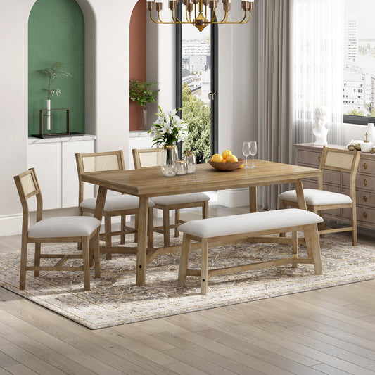 Rustic wood dining table with cane back chairs and upholstered bench
