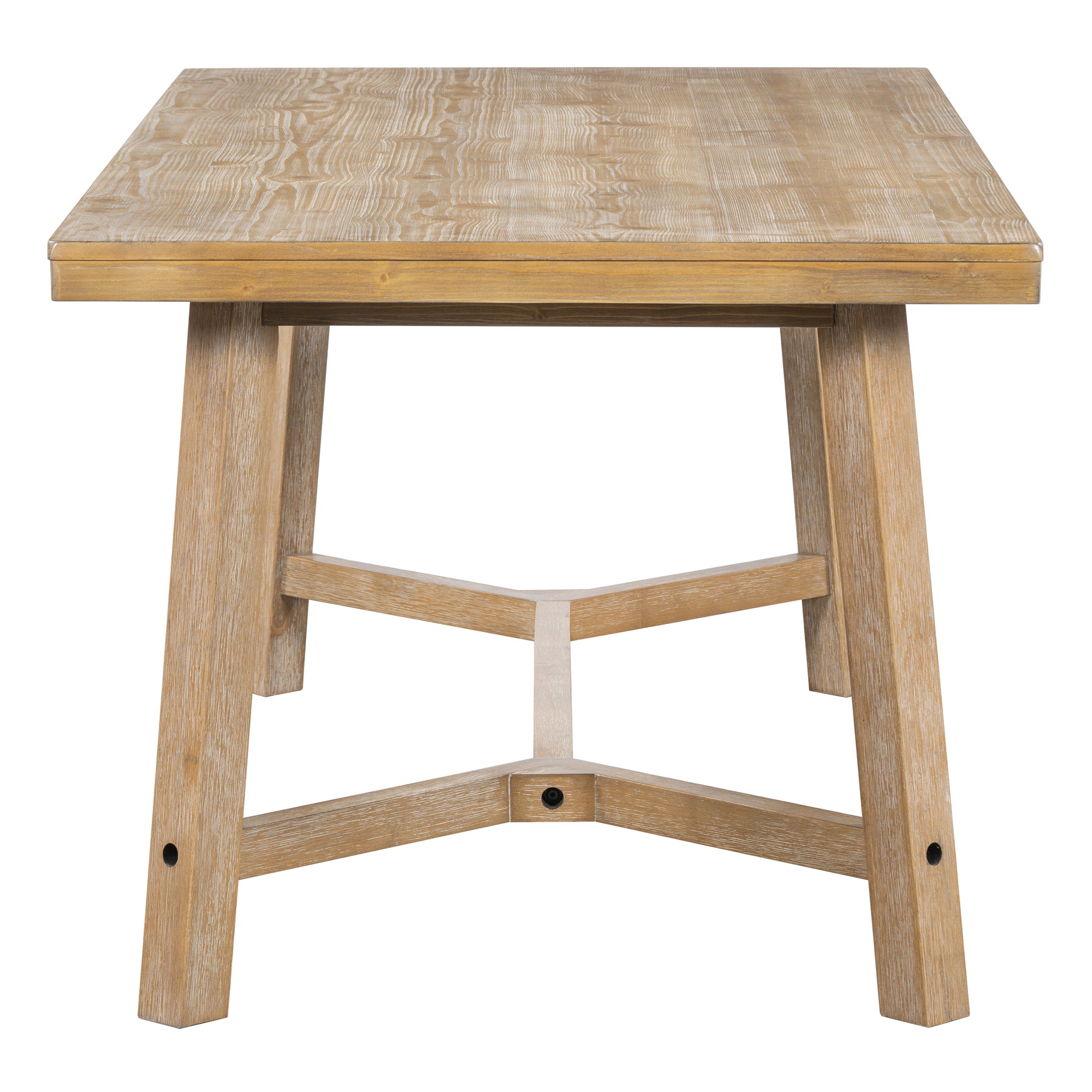 Rectangular wooden dining table with a natural distressed finish and unique crossed leg support