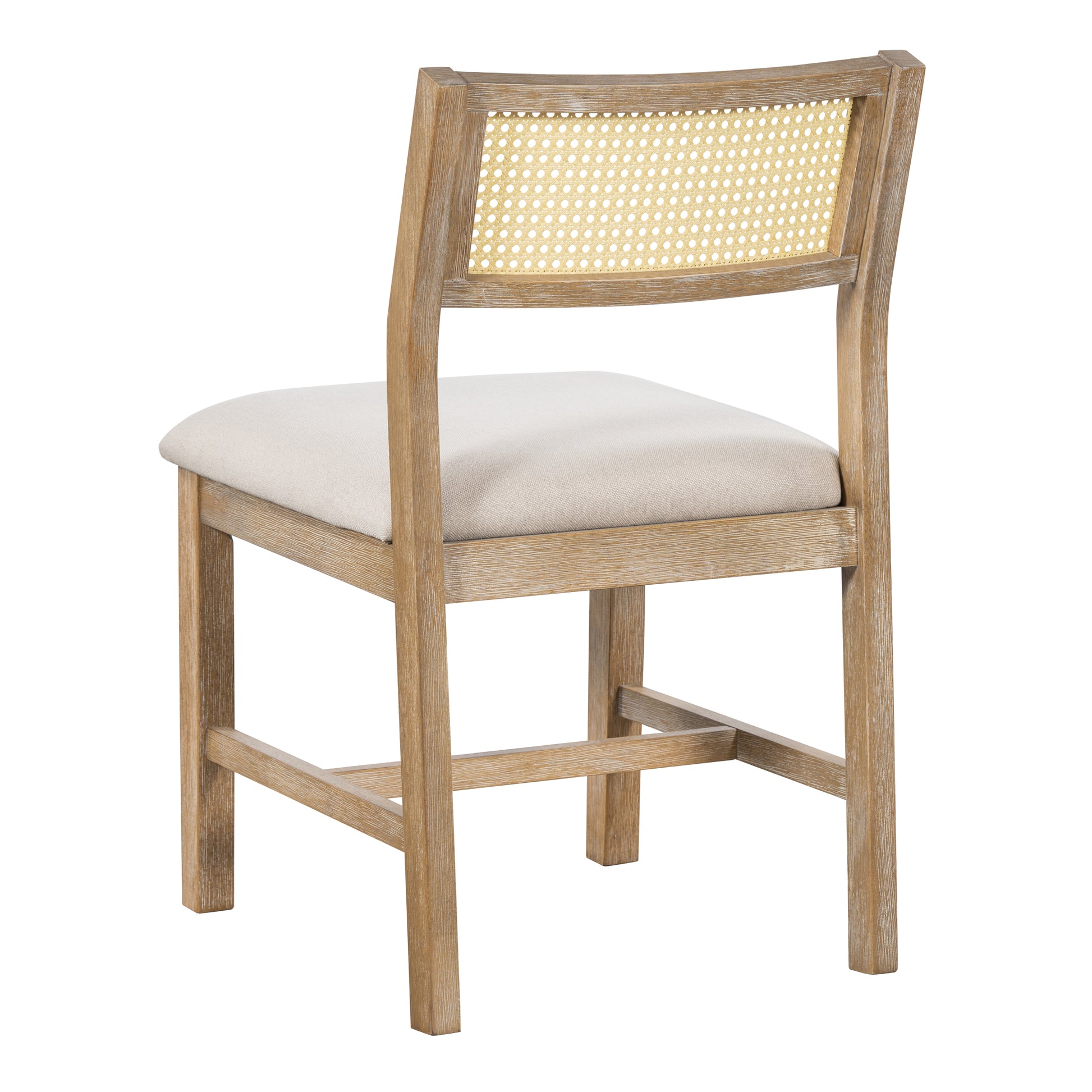 Wooden dining chair with woven cane back and neutral linen seat