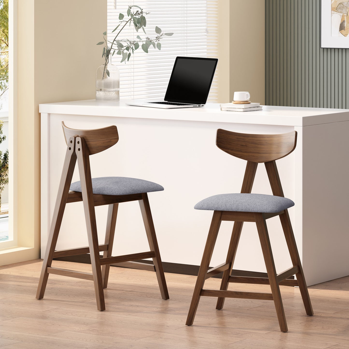 Two midcentury modern walnut bar stools with grey upholstered seats