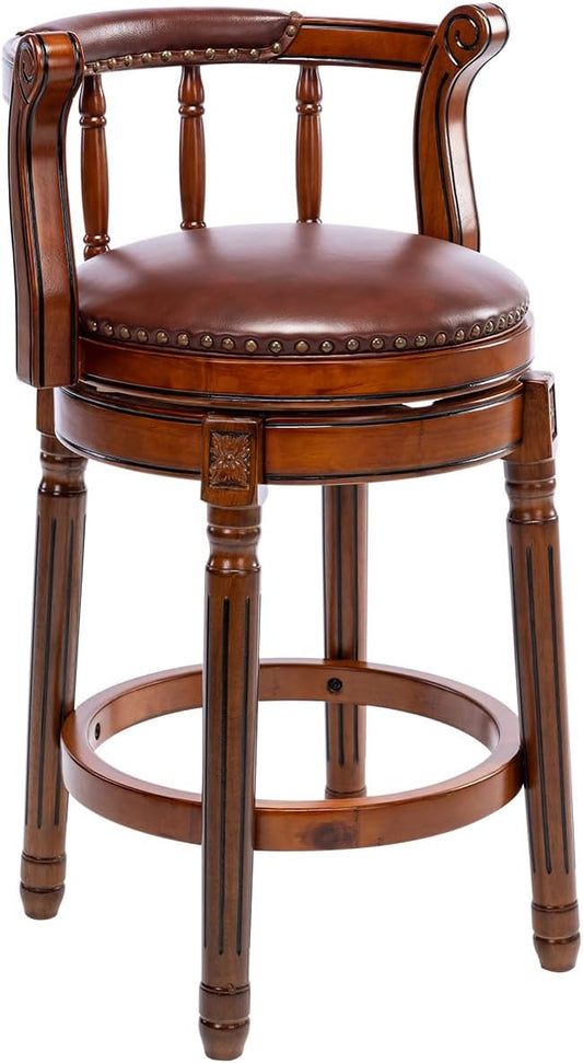 Brown leather swivel bar stool with nailhead trim and carved wood legs