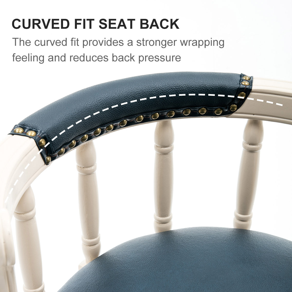 Closeup of a navy blue upholstered armrest with antique brass nailhead trim on a creamcolored wooden chair frame