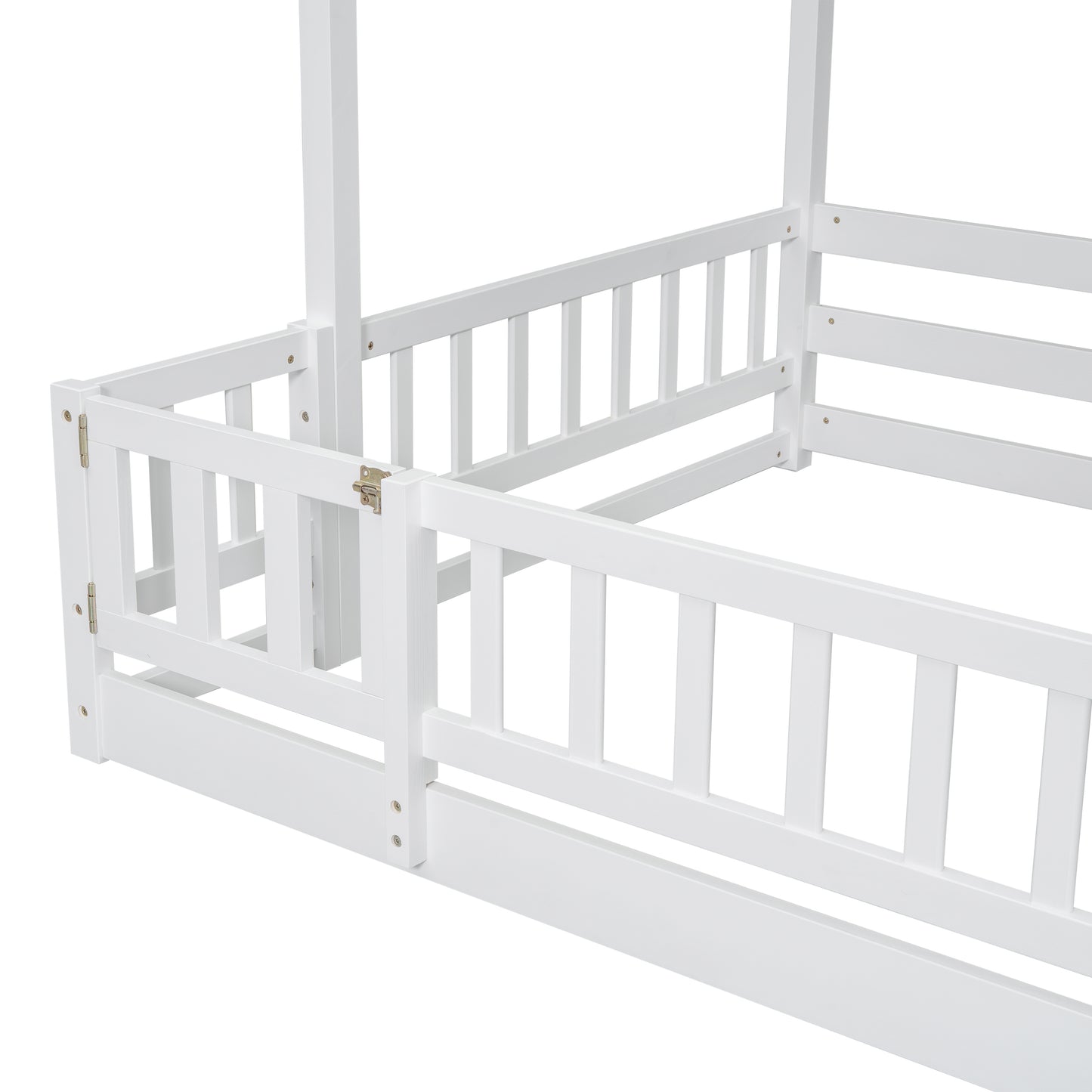 Closeup of a white wooden toddler bed frame with safety rails