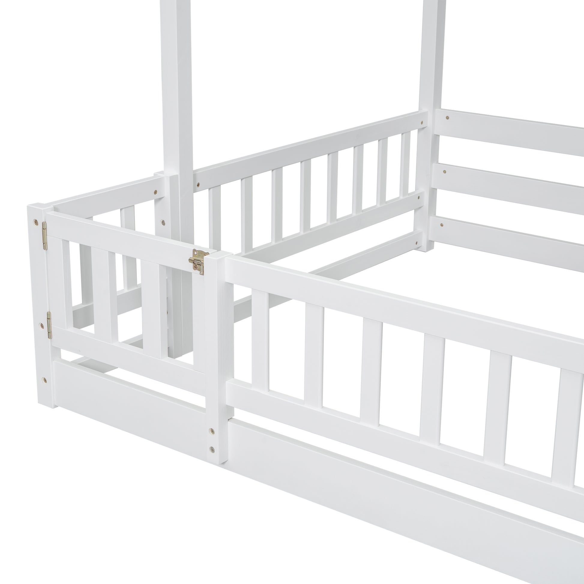 Closeup of a white wooden toddler bed frame with safety rails