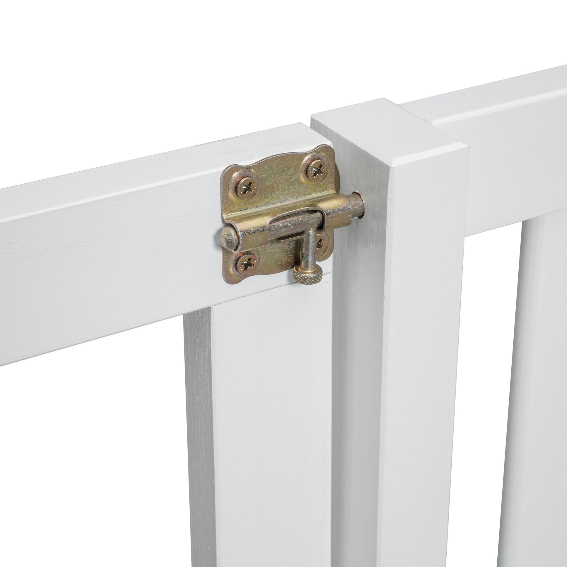 Closeup of white wooden gate with a brass bolt latch