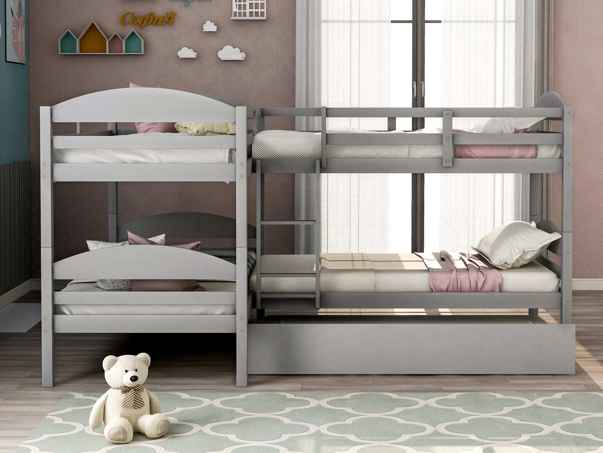 Gray wooden bunk bed with pullout trundle and kids bedding