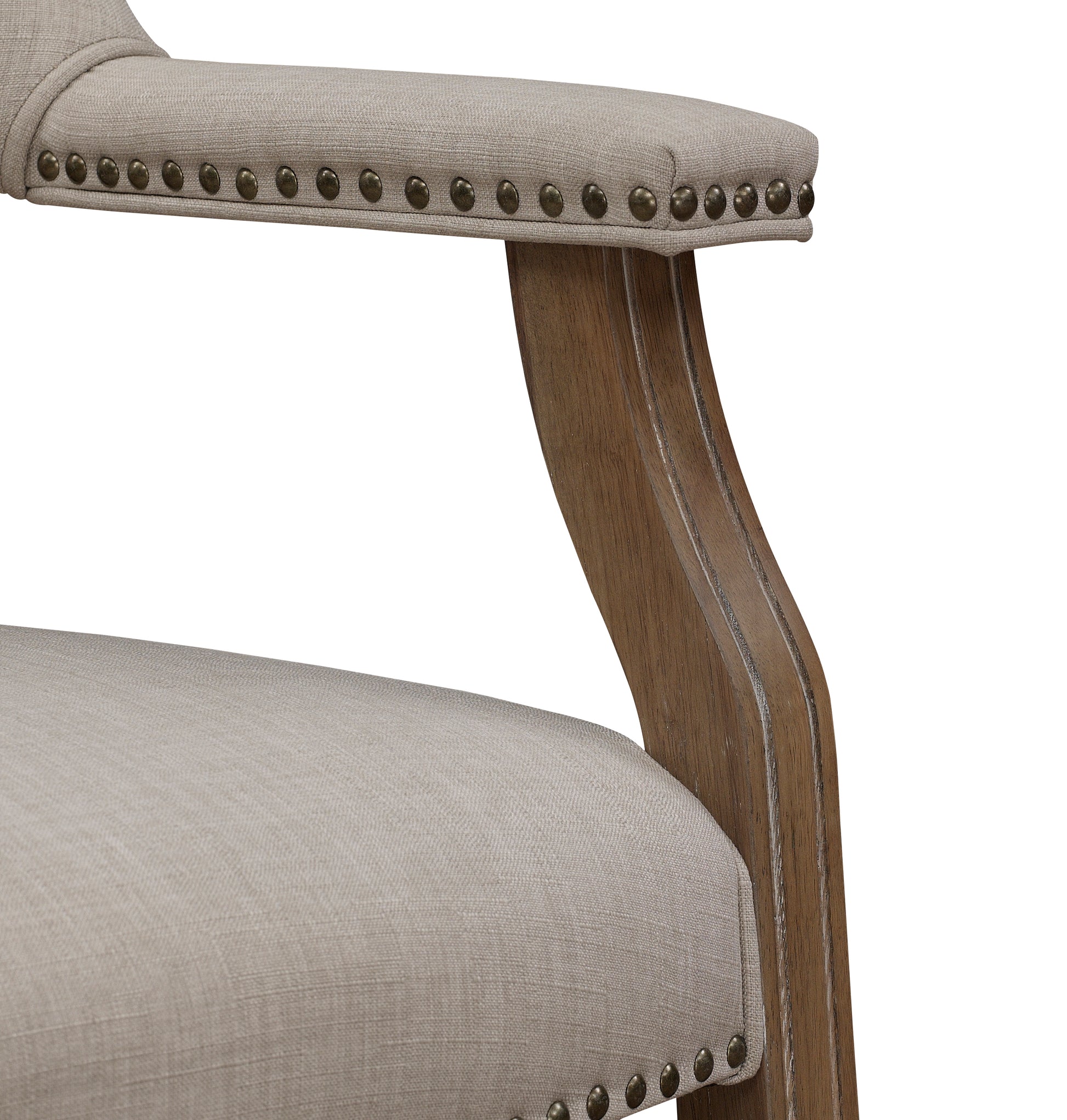 Upholstered armchair armrest with brass nailhead trim and rustic wood detailing