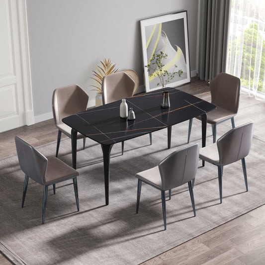 Black marble dining table with gold veining and six gray upholstered chairs