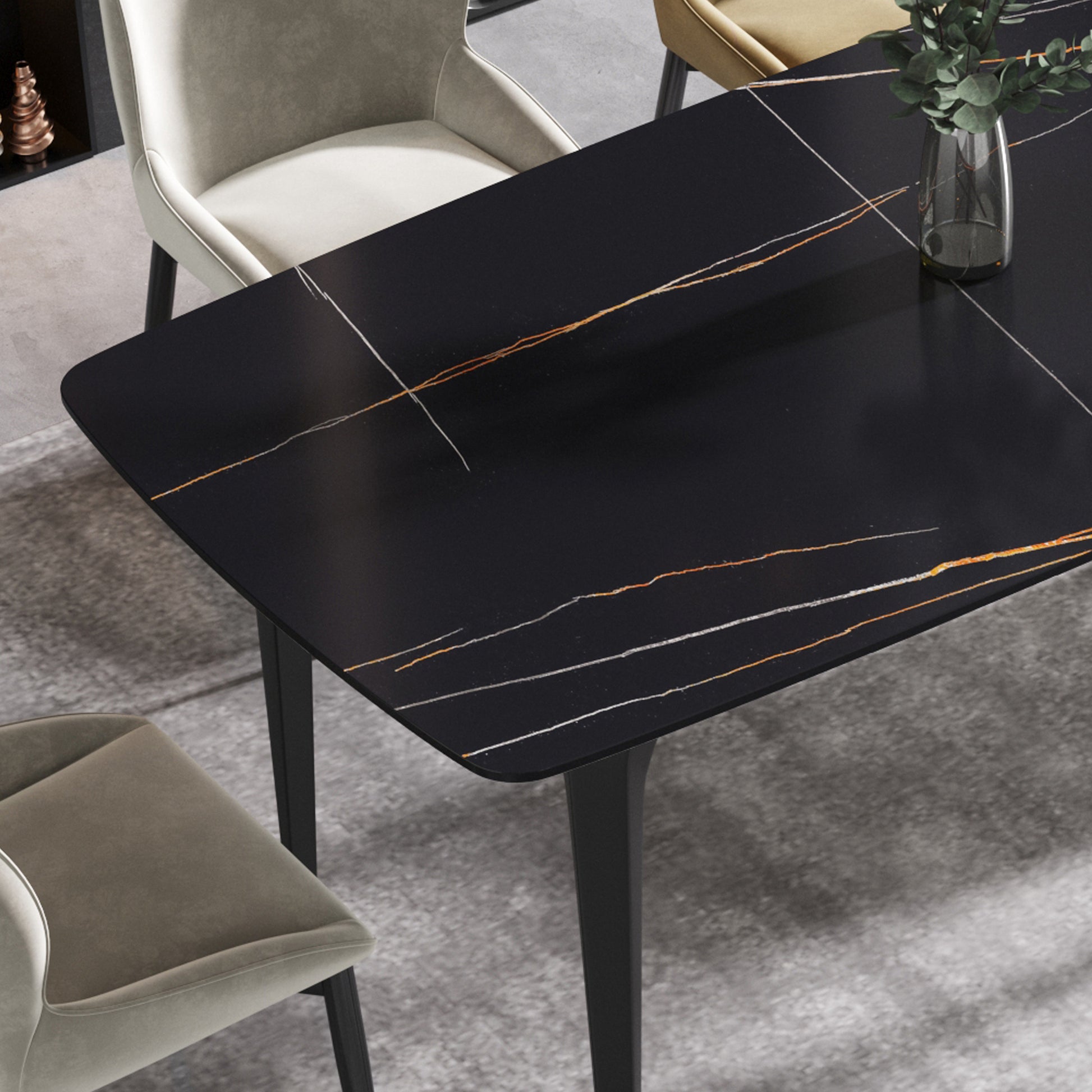 Black sintered stone dining table with white and gold veining