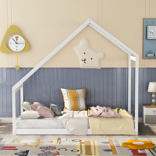 White wooden house bed frame with beige bedding and decorative pillows