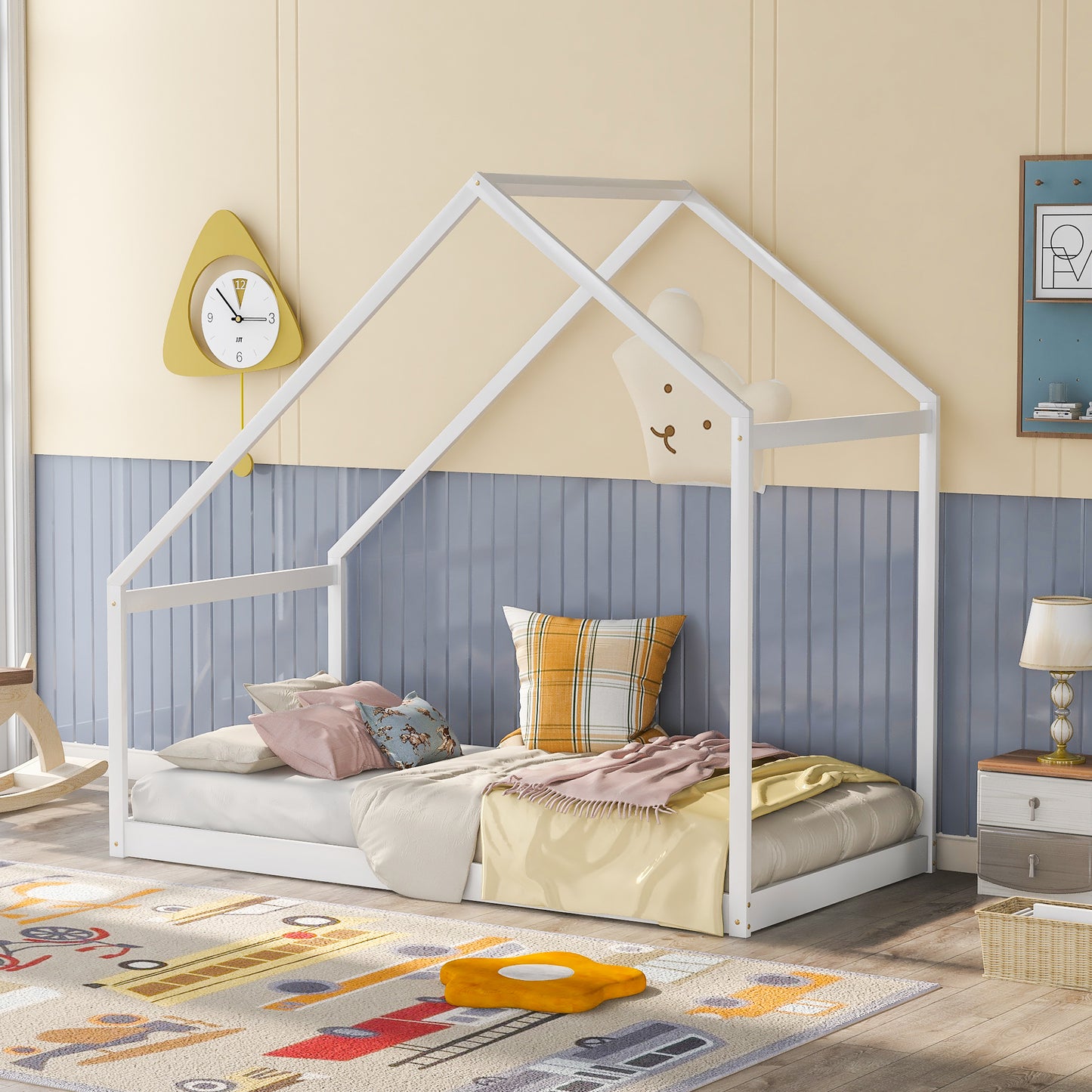White wooden house bed frame with toddler bedding
