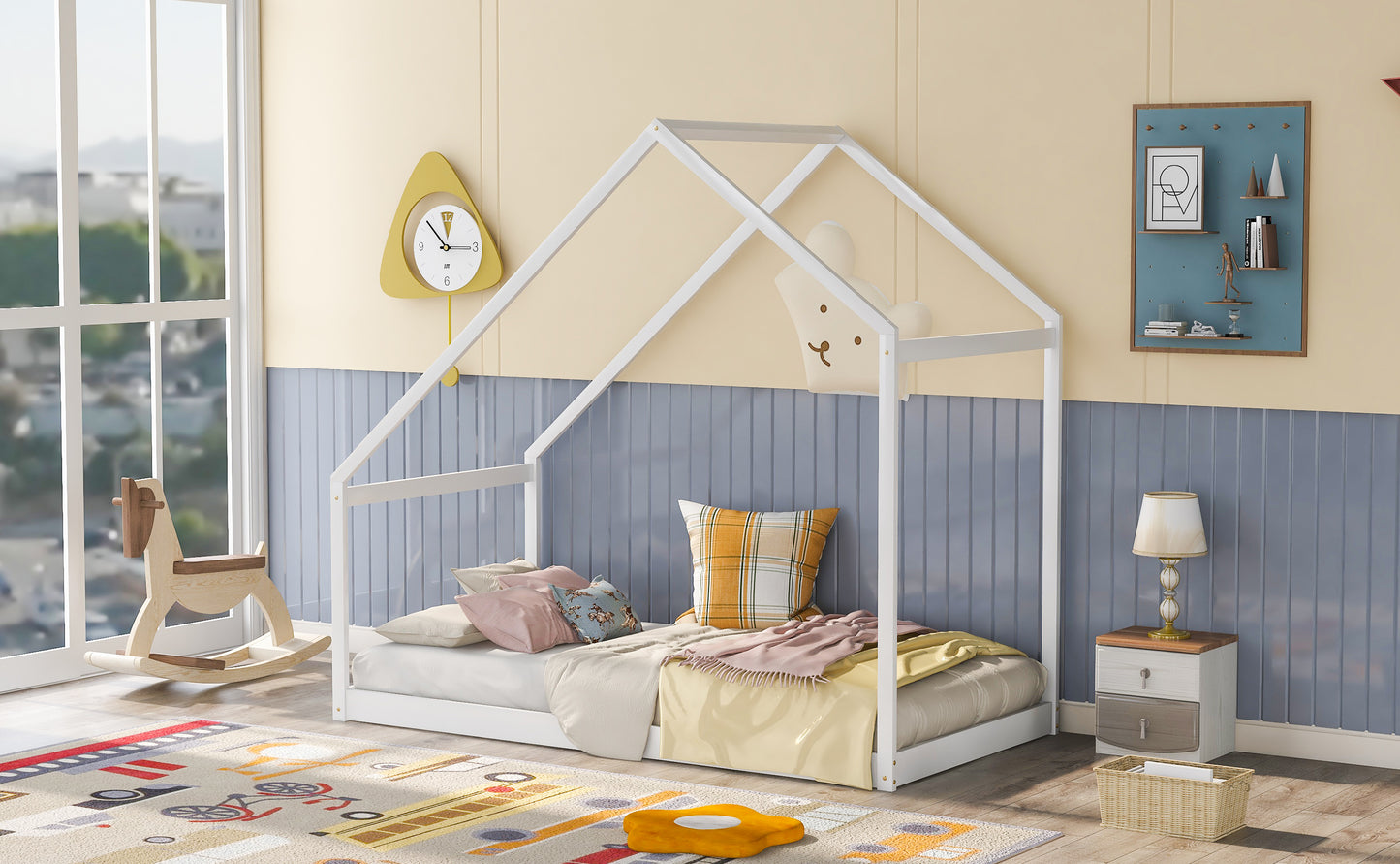 White wood house bed frame with bedding and pillows