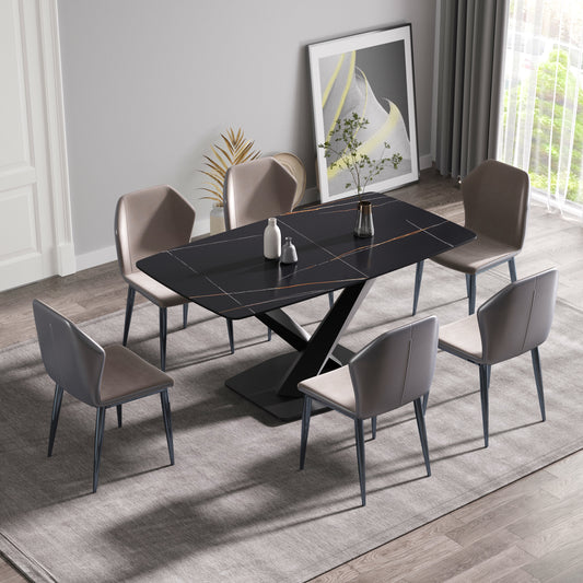 Black marble dining table with gold veins and upholstered chairs