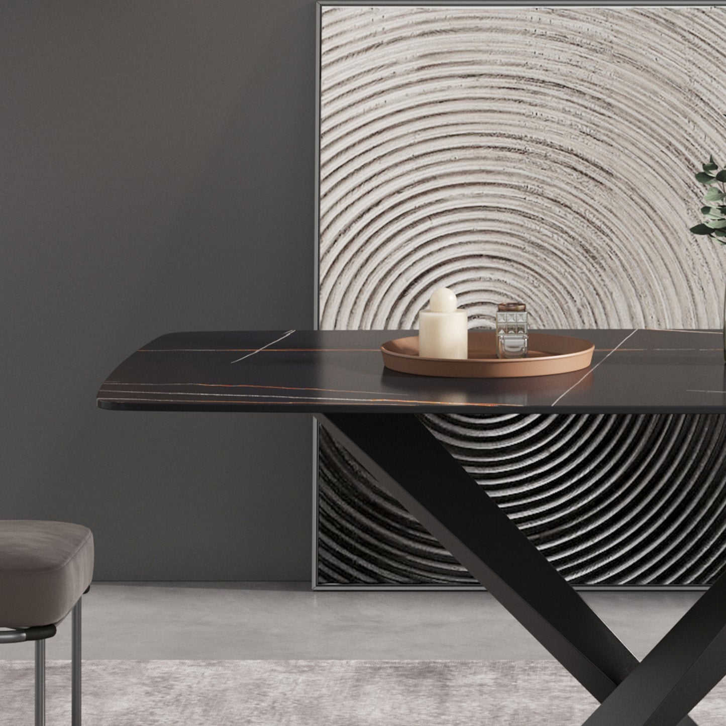 Dark marble dining table with gold veining and minimalist decor