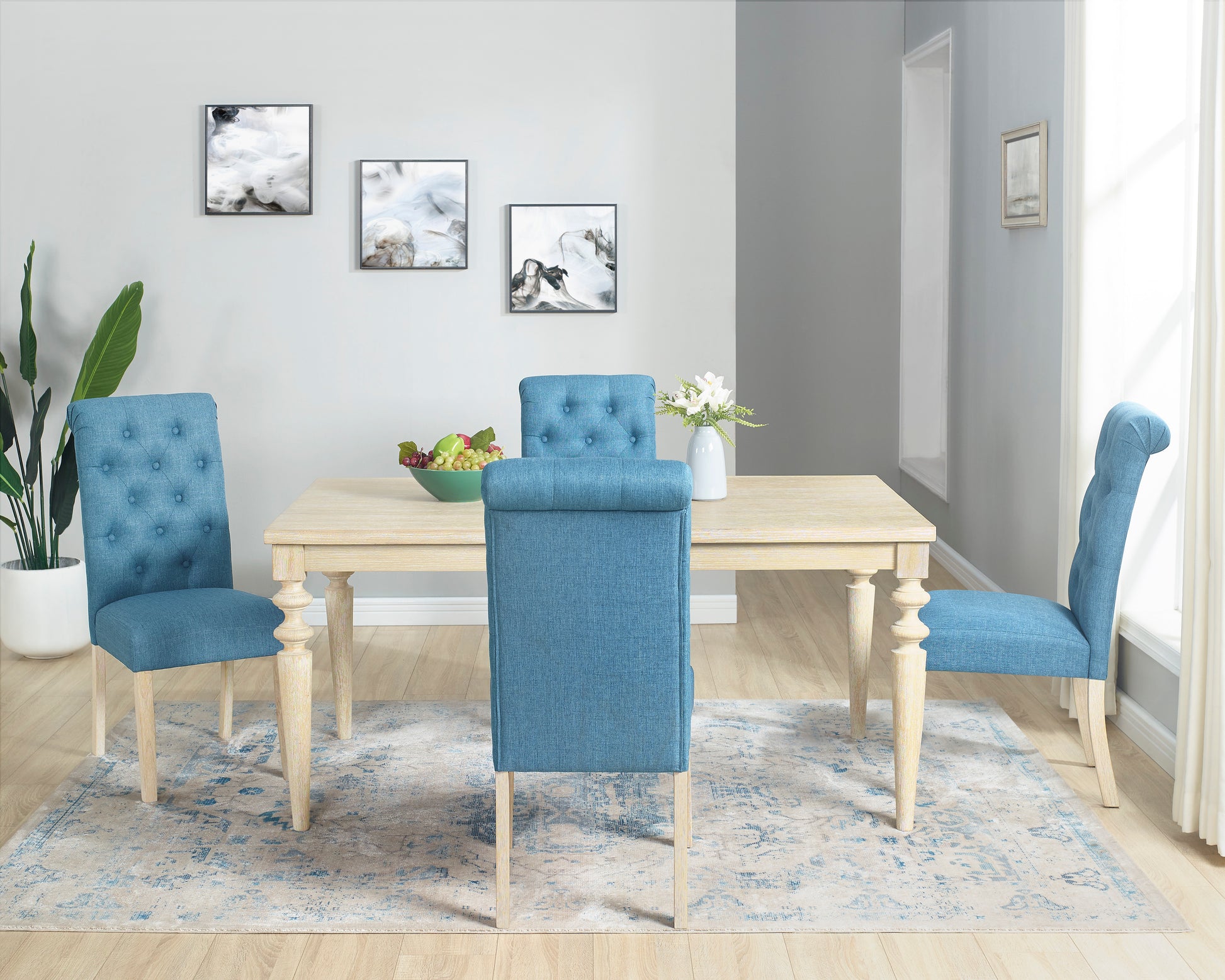 Tufted blue upholstered dining chair with light wood legs