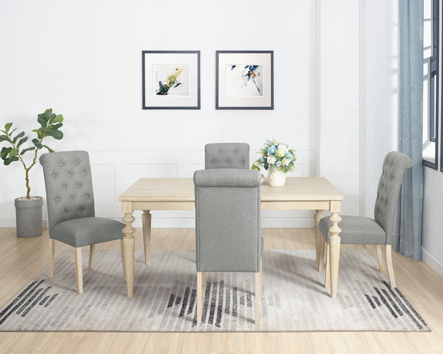 Tufted grey fabric dining chair with button detail on the back