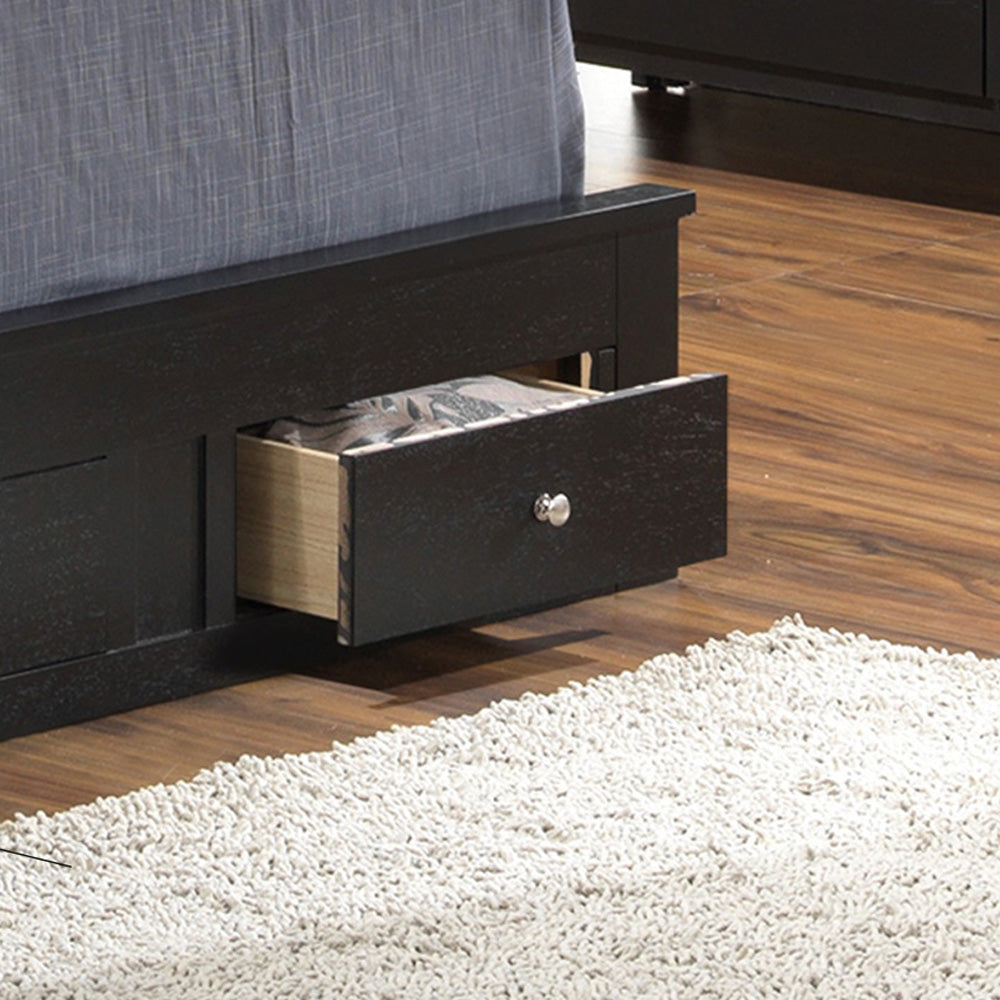Black wooden storage bed frame with open drawer and textured bedding