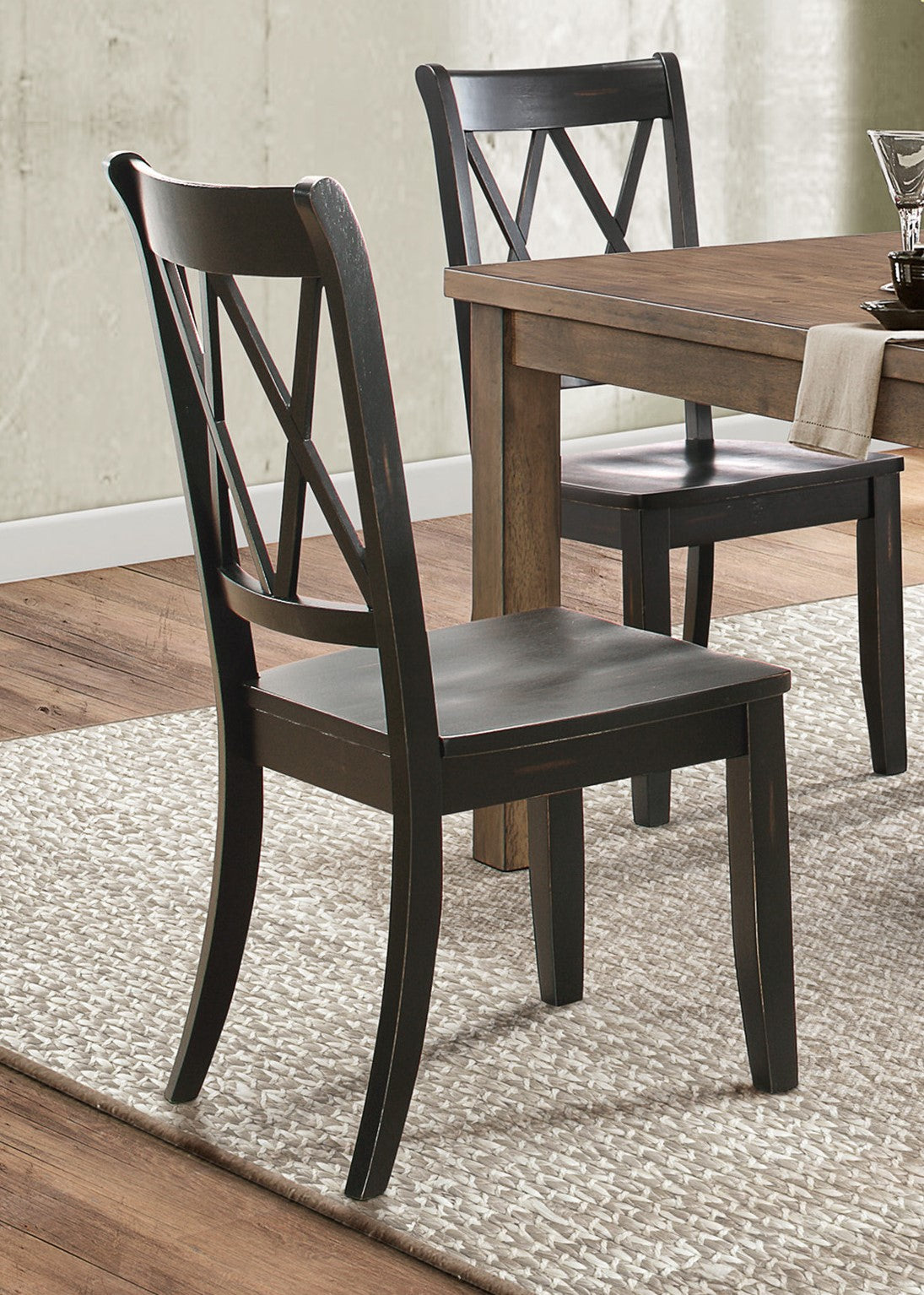 Dark wood dining chair with a distinctive X back design and curved legs