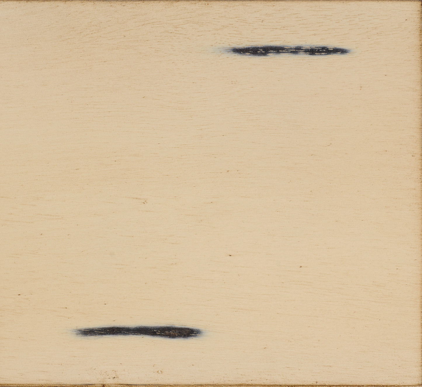 Light tan wooden surface with two horizontal dark grey distressed marks