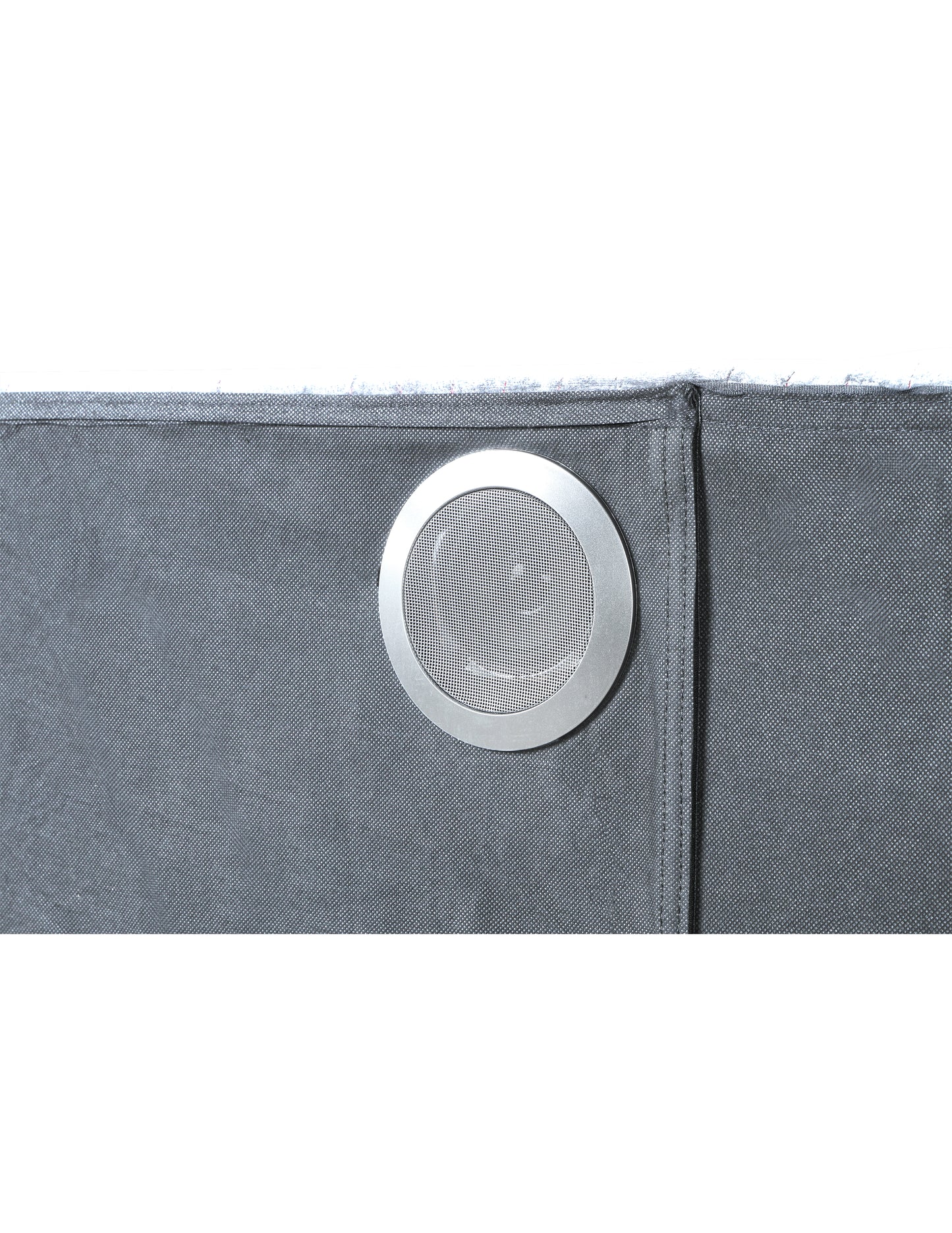 Closeup of a gray fabric speaker grill with silver metallic trim