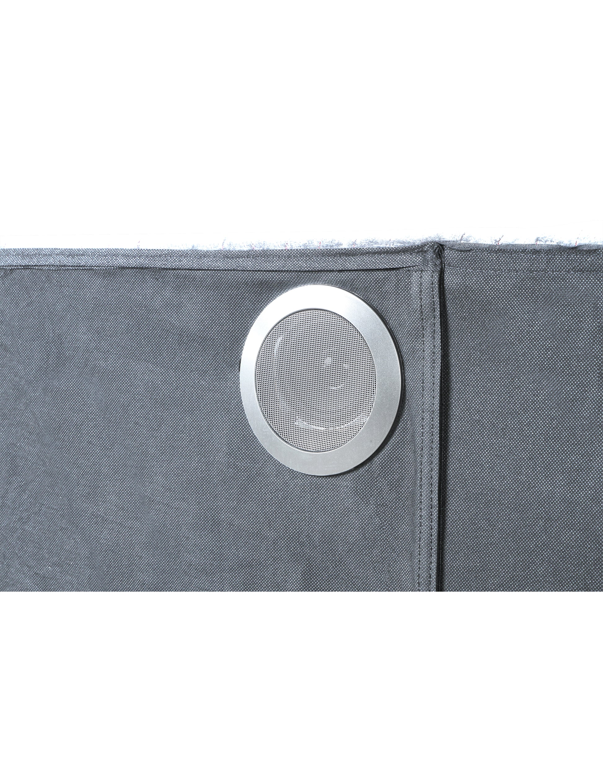 Closeup of a gray fabric speaker grill with silver metallic trim