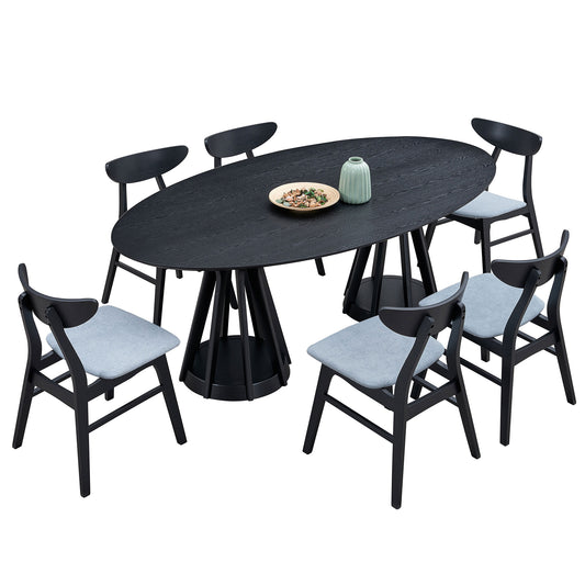 Black oval dining table with six light grey upholstered chairs