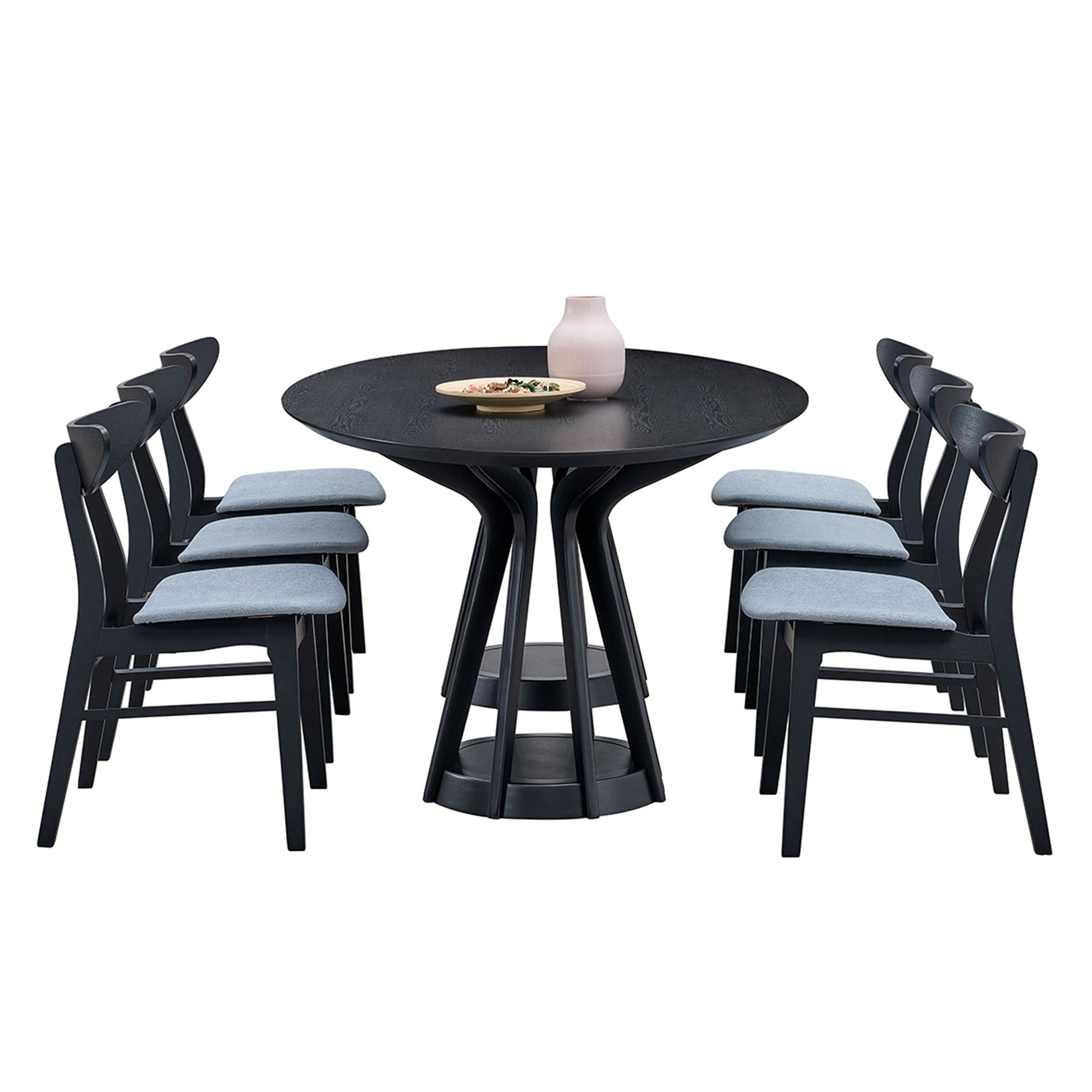 Black round dining table with upholstered grey chairs