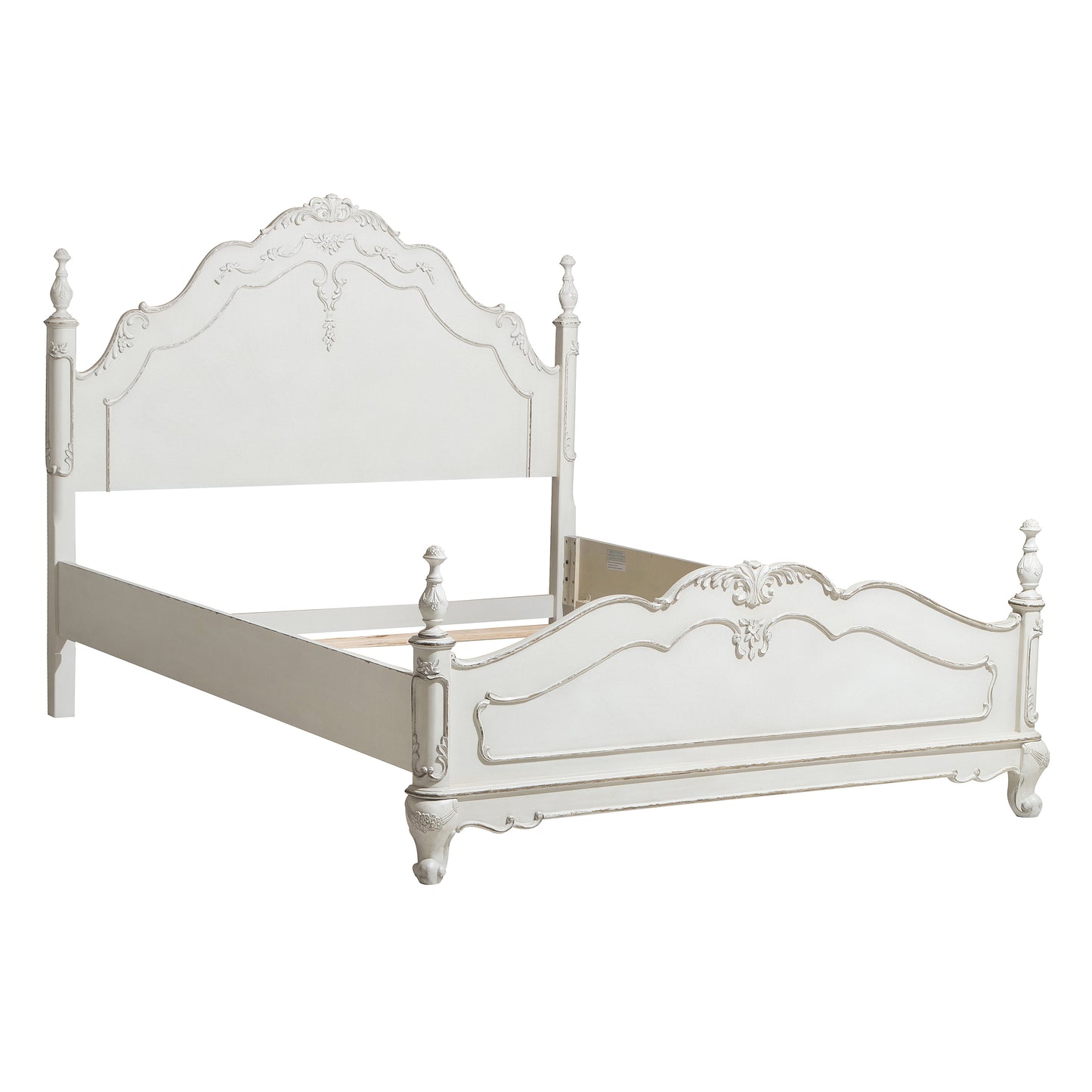 White ornate queen bed frame with carved details and turned posts