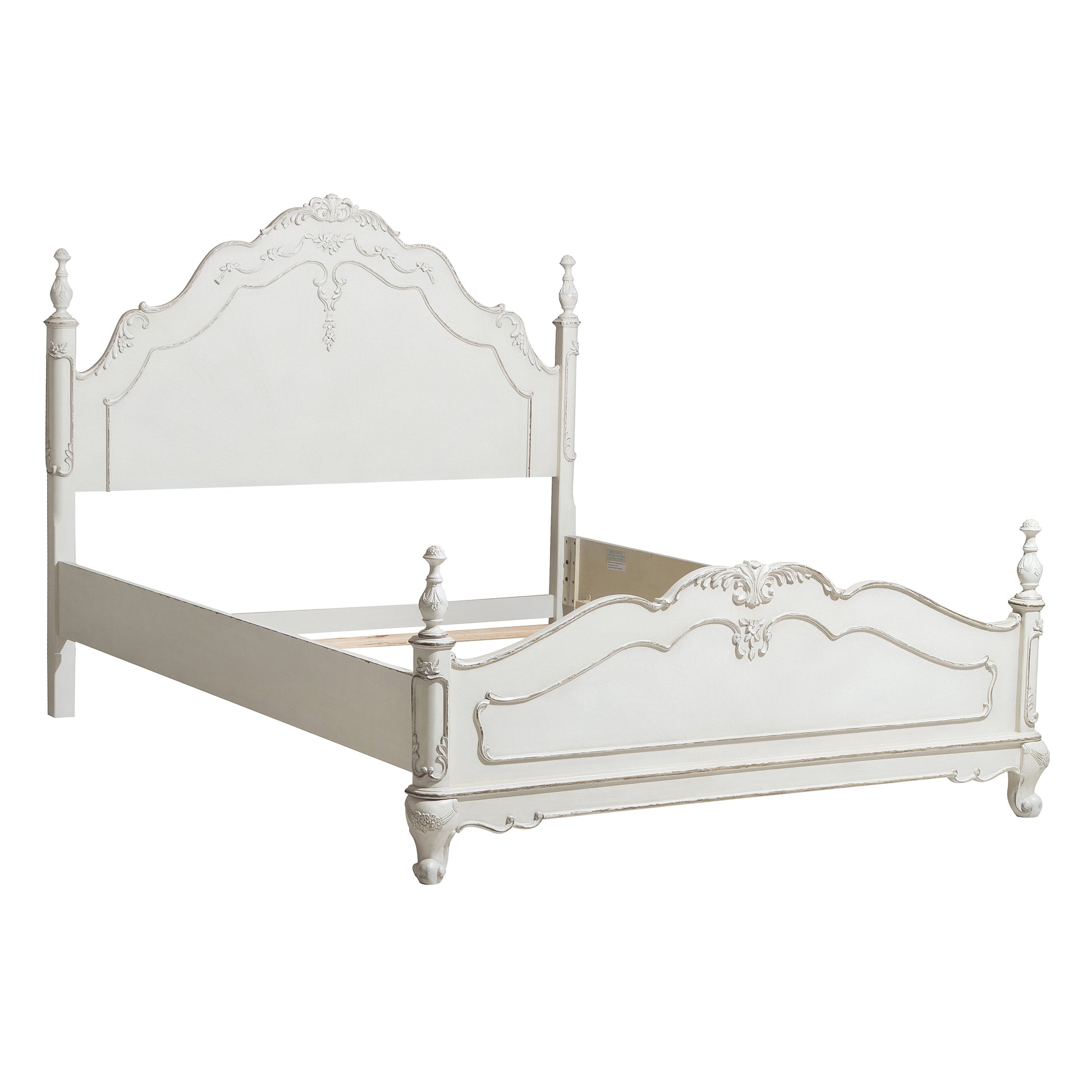 White ornate queen bed frame with carved details and turned posts