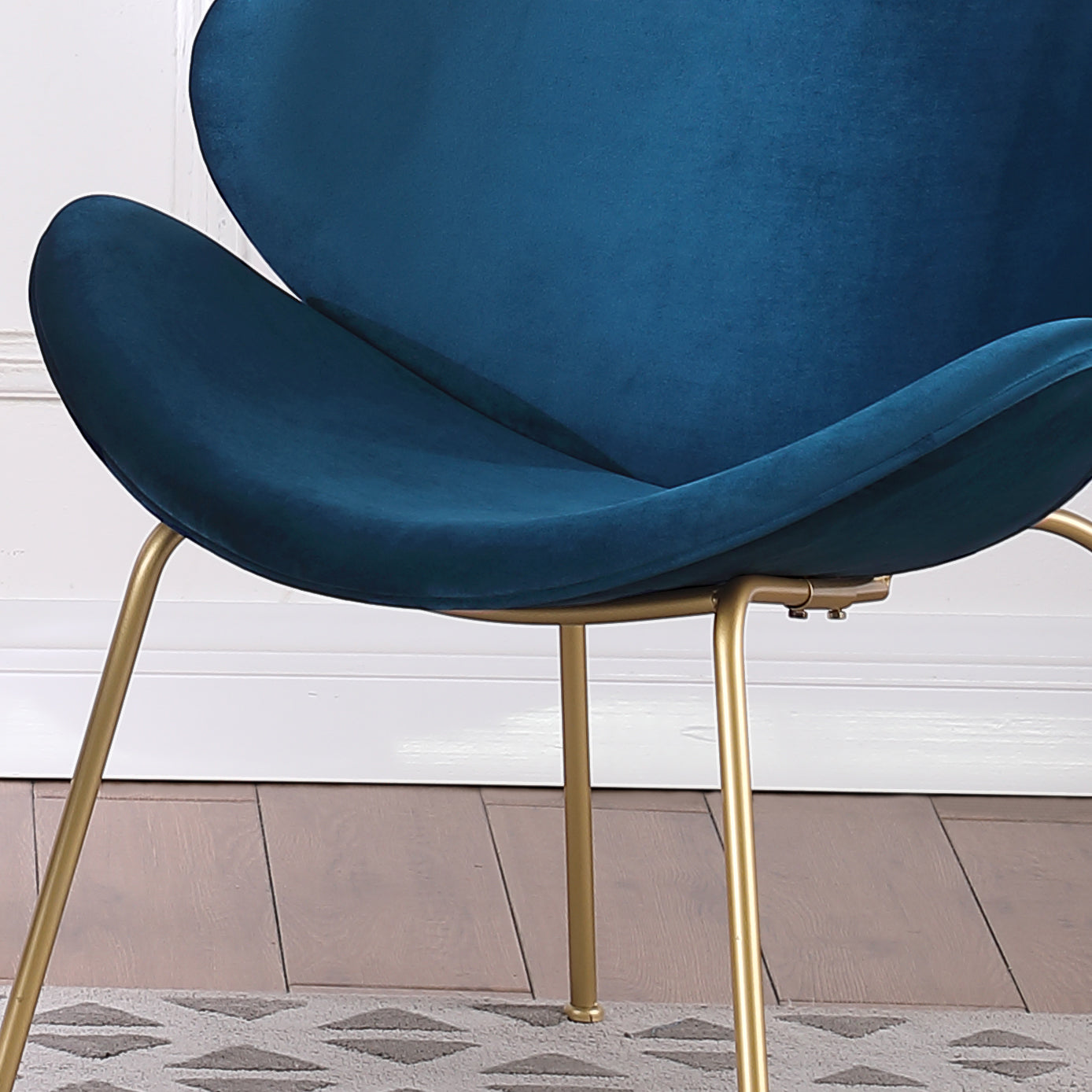Elegant teal velvet accent chair with sleek gold metal legs
