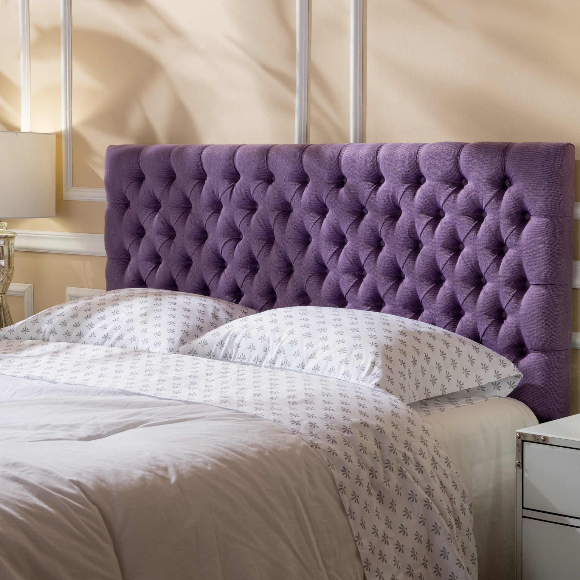 Deep purple velvet tufted headboard with diamond pattern