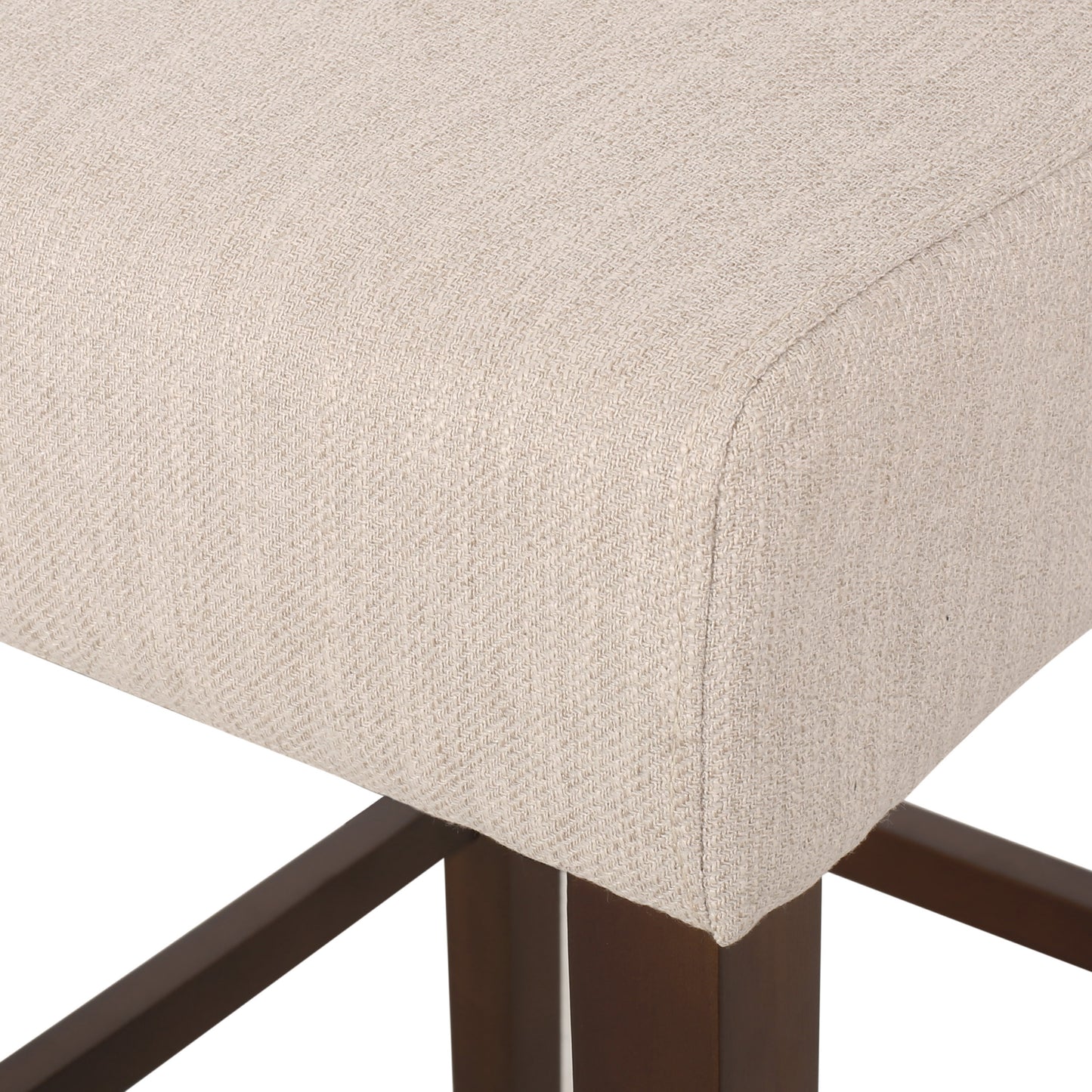 Closeup of natural linen fabric seat cushion with dark wood legs