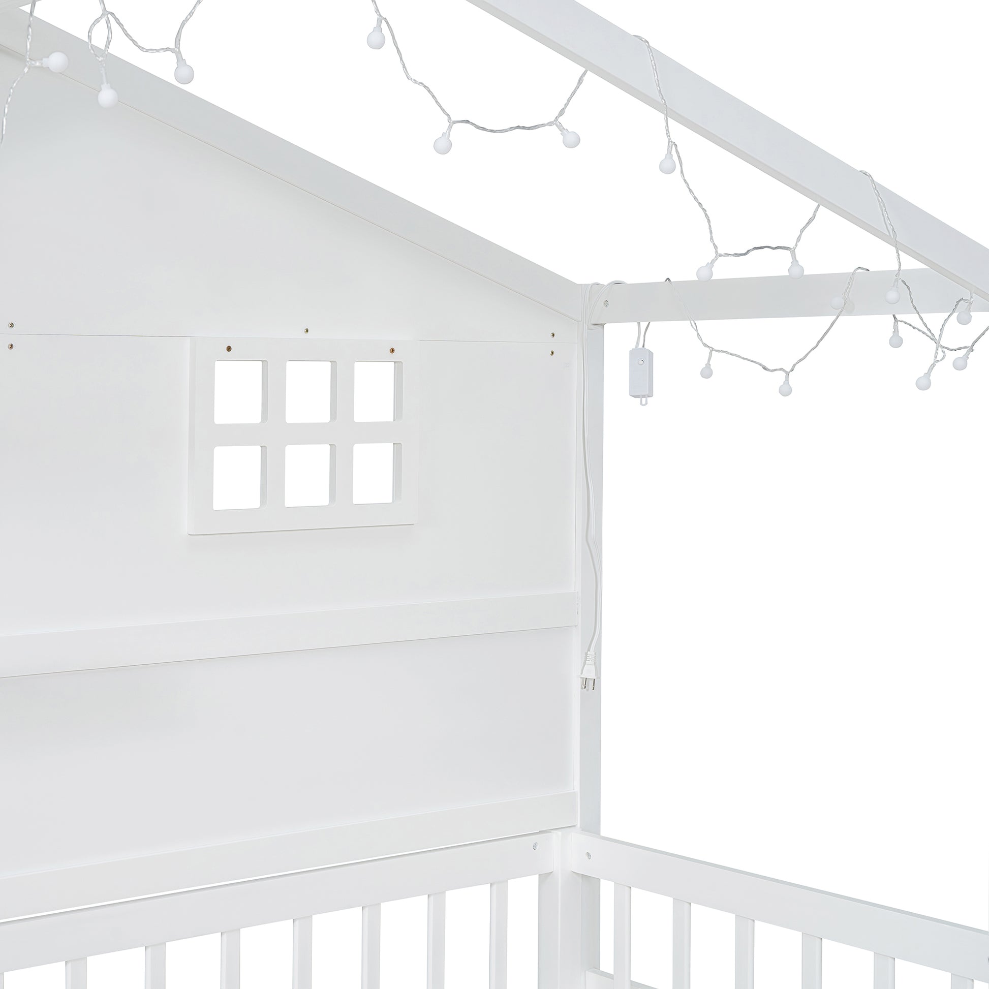 White wooden house bed frame with playful string lights and window detail