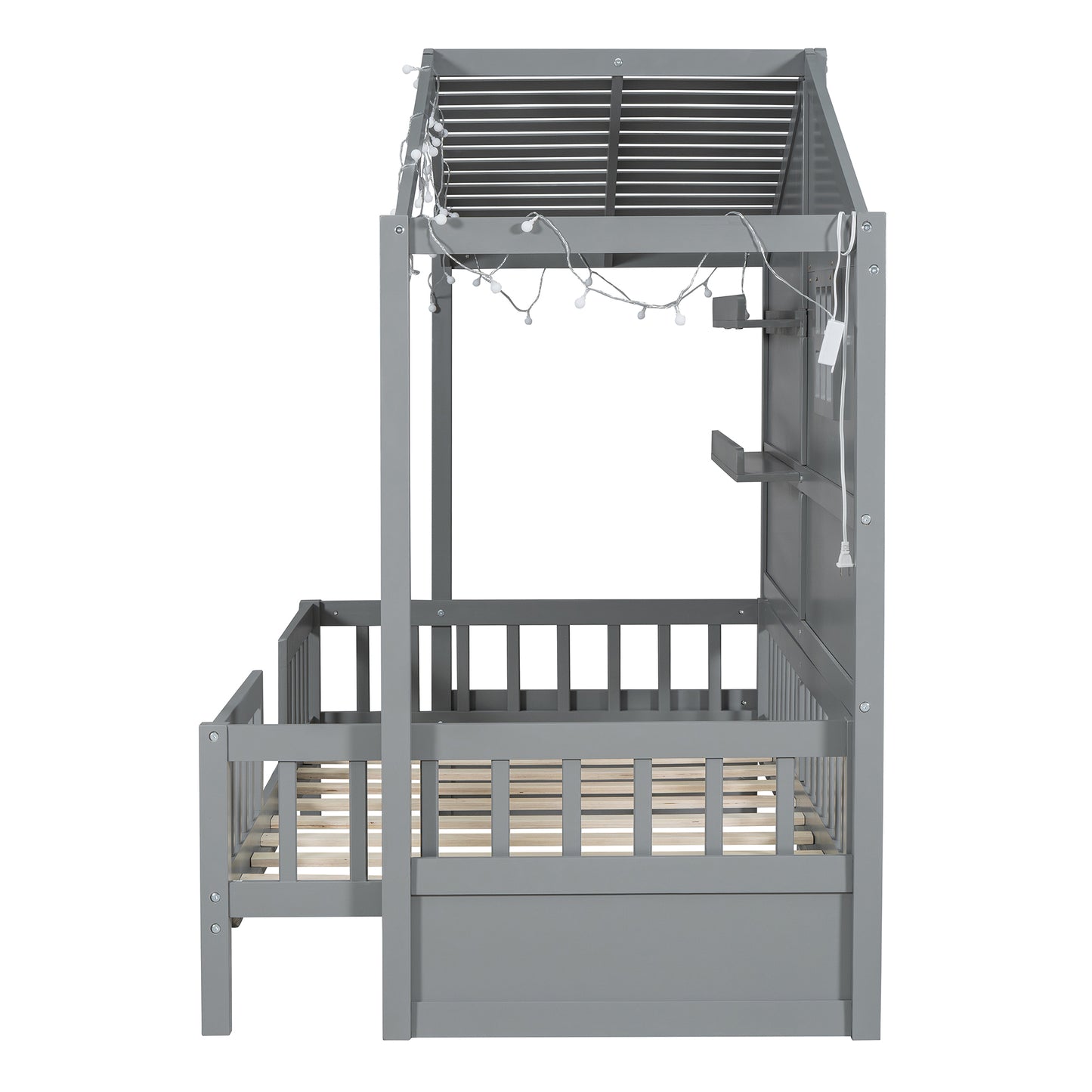 Gray wooden toddler bed with builtin railing and string lights