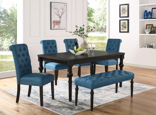 Dark wood dining table with blue tufted chairs and bench