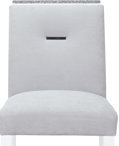 Grey upholstered dining chair with a tufted back and crystal accent strip